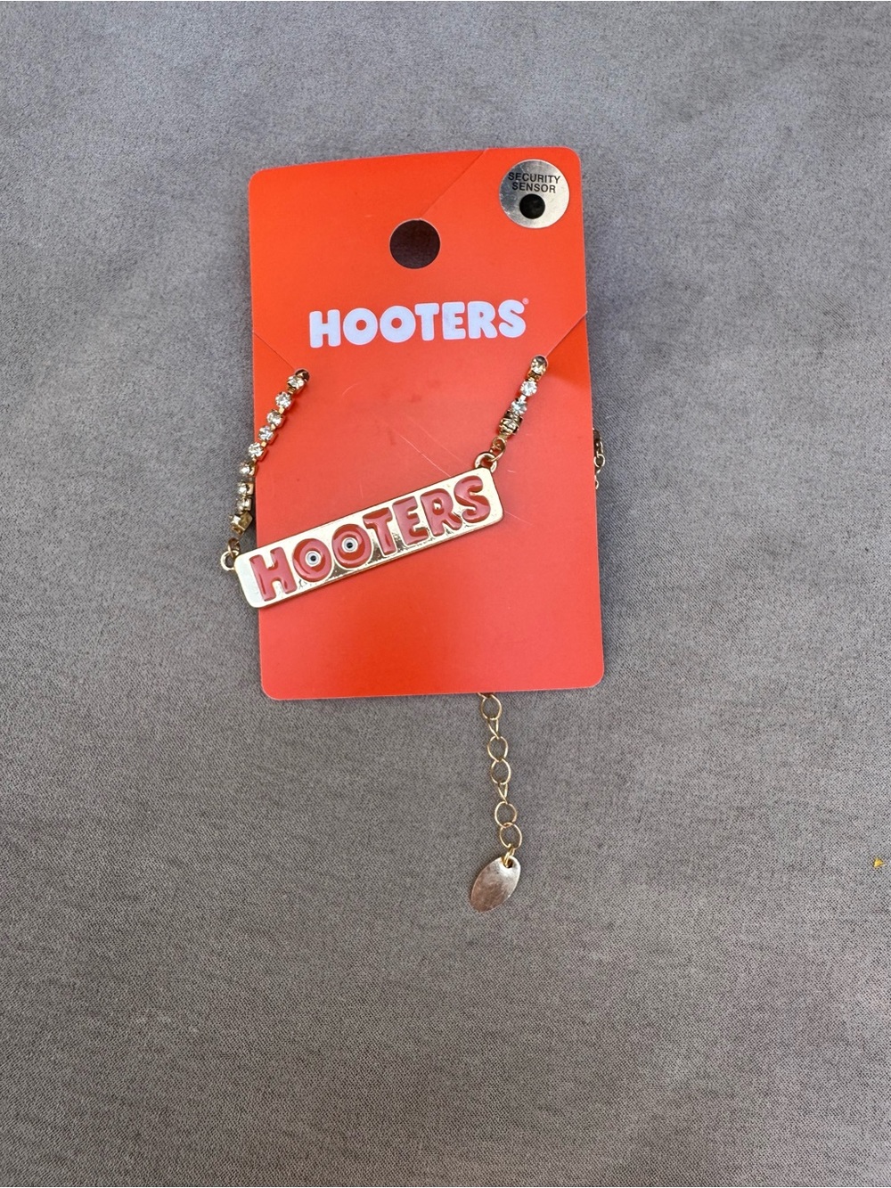 Hooters Gold-Tone Necklace with Red Logo Bar